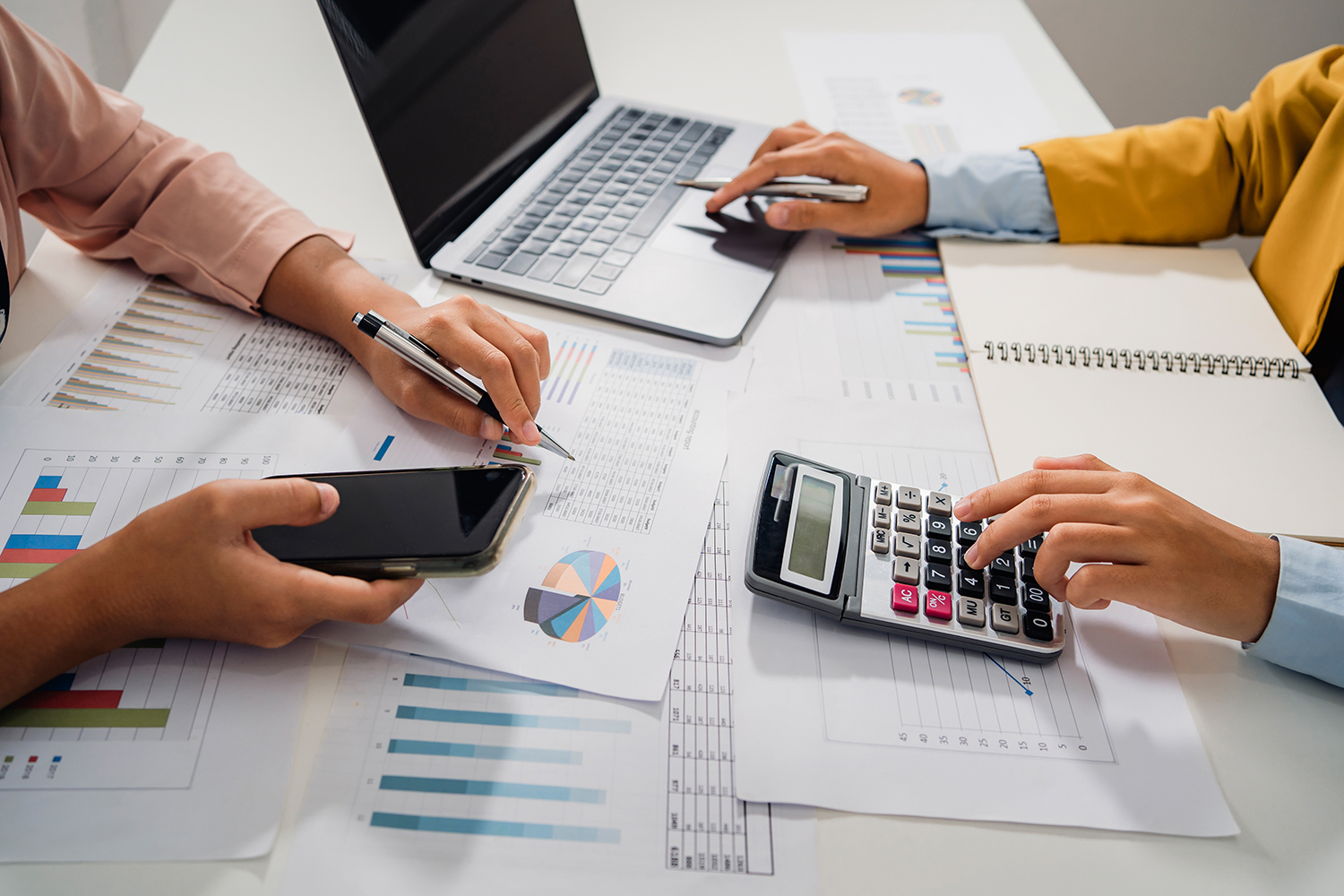 Accountants reviewing financial reports together